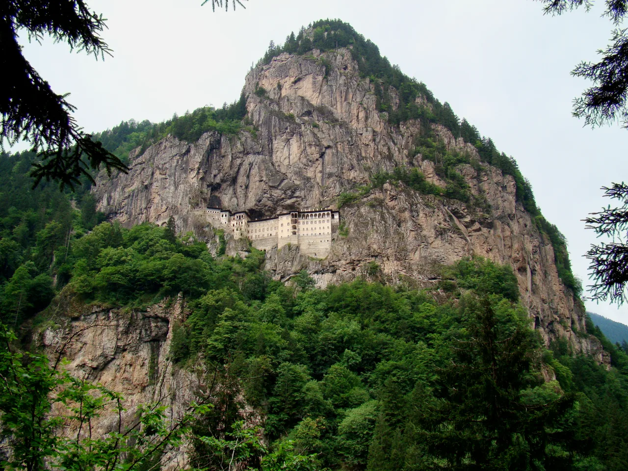 Sümela Monastery built into a steep cliff above the wooded valley; an archive view from 2009.